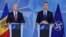NATO Secretary-General Jens Stoltenberg (right) and Moldovan Prime Minister Pavel Filip give a press conference after their meeting at NATO headquarters in Brussels on March 30.