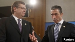 NATO Secretary-General Anders Fogh Rasmussen (right) talks to Ukraine's Foreign Minister Kostyantyn Hryshchenko during the meeting in Berlin on April 15.