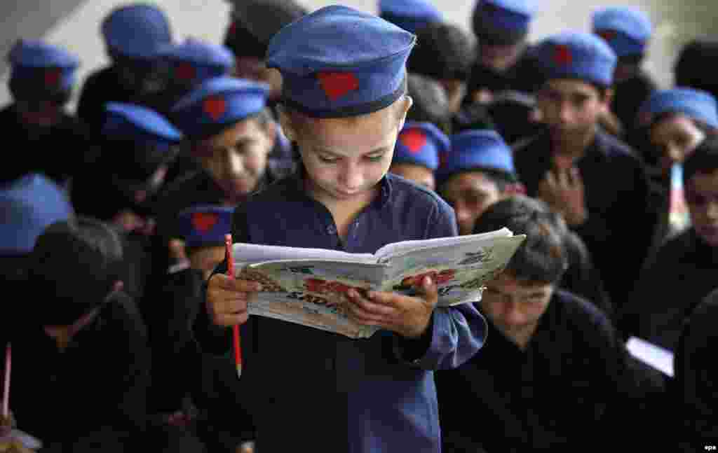 A Pakistani boy reads aloud in school a day ahead of International Literacy Day (September 8) in Peshawar. (epa/Bilawal Arbab)