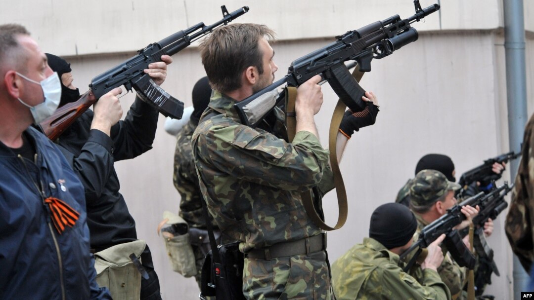 Armed pro-Russia militants attack the regional police building of the eastern Ukrainian city of Luhansk on April 29.