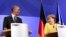 U.S. President Barack Obama (left) and German Chancellor Angela Merkel address a press conference after their bilateral talks at the Herrenhausen Palace in Hannover on April 24.