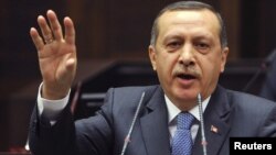 Turkey -- Prime Minister Tayyip Erdogan addresses members of parliament from his ruling AK Party (AKP) during a meeting at the parliament in Ankara, 24Jan2012