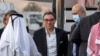 US citizens Siamak Namazi (C), Emad Sharqi (L behind) and Morad Tahbaz (C-R) disembark from a Qatari jet upon their arrival at the Doha International Airport in Doha on September 18, 2023.