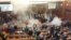 WATCH: Tear Gas Disrupts Kosovo's Parliament