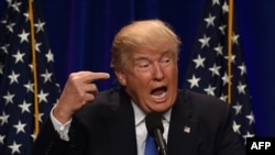 Republican presidential candidate Donald J. Trump speaks at the Saint Andelm College New Hampshire Institute of Politics in Manchester, New Hampshire, June 13.