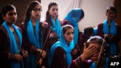 Members of Afghanistan's first all-female orchestra Zohra get ready for a performance in Modra, Slovakia, on July 15.