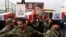 Members of the Popular Mobilization Forces carry the remains of fighters killed in suspected US air strikes in Baghdad in April. 