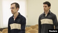 U.S. nationals Shane Bauer (left) and Josh Fattal, detained in Iran on spying charges, during the first session of their trial in a Tehran Revolutionary Court on February 6