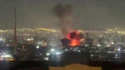 This video grab taken from UGC images posted on social media on March 1 shows an explosion following a strike on Tehran that appears to have occurred near state television channel IRIB.