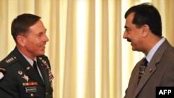 Pakistan's Prime Minister Yousaf Raza Gilani (right) greeting U.S. General David Petraeus in Islamabad.