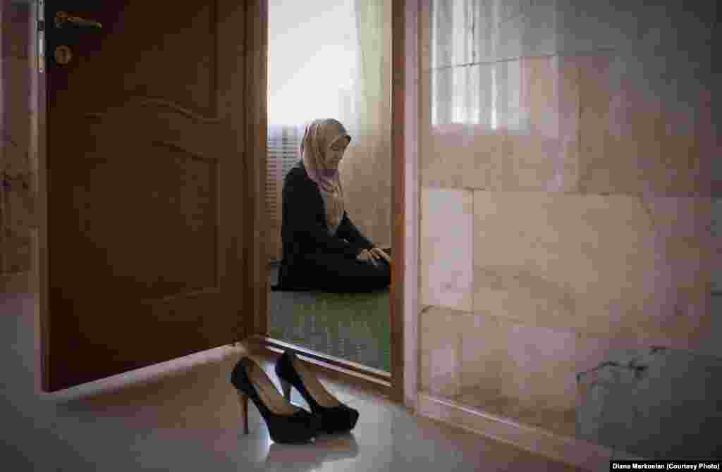 Amina Mutieva, 21, a student at the Islamic University in Grozny, prays in a prayer room for women.