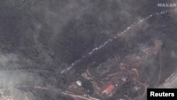 A satellite image shows a long traffic jam of vehicles along the Lachin corridor as ethnic Armenians flee Nagorno-Karabakh, September 26, 2023.
