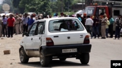 A car used by alleged militants is seen with smashed windows outside the police station in Dinanagar, Gurdaspur on July 27