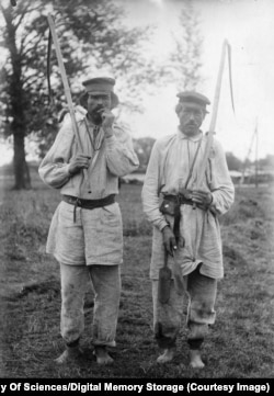 Unidentified men are seen in a photograph that was part of the personal archive of Ukrainian archaeologist Fedir Vovk.