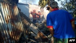 Zgrade oštećene nakon pada vojnog aviona u Džakarti, 21. jun 2012.