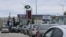 Ukraine -- Cars queue for fuel at a gas station after the authorities restricted fuel sales 