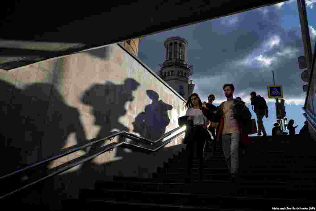 People walk down an underpass during sunset in Moscow on September 15. (AP/Alexander Zemlianichenko)