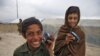 The radio distribution drive began on September 17 in a camp for internally displaced people on the outskirts of Kabul. These two boys were among the first to receive one of the 20,000 radios RFE's Afghan service Radio Azadi has since been distributing across the entire country.