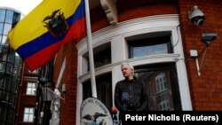 WikiLeaks founder Julian Assange is seen on the balcony of the Ecuadorian Embassy in London