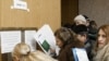 Russia -- Migrant workers queueing in an office of the Federal Migration Service for Nizhni Novgorod Region to submit their applications for work permits, 07Mar2007