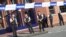 Police stand as they secure the area around a police building in the southern Belgian city of Charleroi following a machete attack on August 6 that left two policewomen wounded. 
