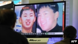 Men at a railway station in Seoul, South Korea, look at a television screen showing images of what is thought to be Kim Jong Un, the youngest son of North Korean leader Kim Jong Il on September 28.