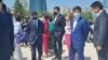 Первый заместитель председателя партии «Нур Отан» Бауыржан Байбек (второй справа) на церемонии открытия детской площадки. Нур-Султан, 27 мая 2021 года. 
