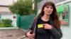 Katsyaryna Barysevich shows her prison label to colleagues upon her release from the prison in Komarovka on May 19.
