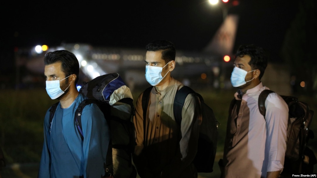 Evacuated Afghans arrive at Tirana International Airport in Albania in August 2021.