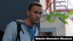 Russian opposition leader Aleksei Navalny leaves a Moscow court after a hearing on August 27. 