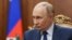 In this pool photograph distributed by the Russian state agency Sputnik, Russia's President Vladimir Putin attends a meeting with Russian Deputy Prime Minister at the Kremlin in Moscow on October 6, 2025. (Photo by Alexander KAZAKOV / POOL / AFP)