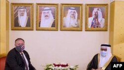  US Secretary of State Mike Pompeo (L) meeting with Bahrain Foreign Minister Abdullatif bin Rashid Al-Zayani (R) upon his arrival in the capital Manama. - Pompeo