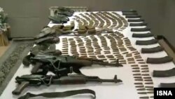 Weapons police say were captured from an armed group in Sanandaj, Iran. May 31, 2019