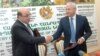 Armenia -- Energy Minister Armen Movsisian (L) and Agriculture Minister Sergo Karapetian sign a memorandum on the production of fertilizers in Vanadzor, 3June2012.