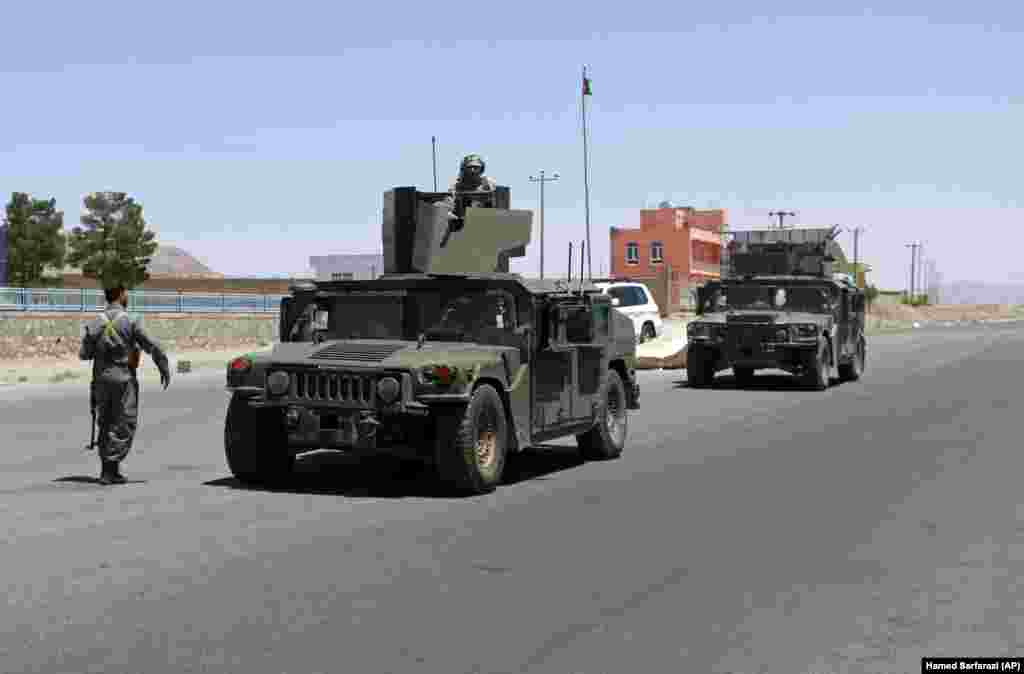 Afghan security personnel on patrol in Herat after fighting Taliban militants on the outskirts of the city on August 8.