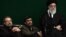 Unlike Iranian President Mahmud Ahmadinejad (center), proposed Iranian election reform could play into the hands of other establishment figures such as parliament speaker Ali Larijani (left) and Supreme Leader Ali Khamenei (right). 
