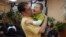 Aaron Moyer holds Vitaly during a visit to his Russian orphanage, before the adoption ban was instituted. Vitaly, who has Down syndrome and a life-threatening heart condition, still lives in an orphanage.