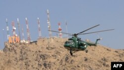 A Russian-made Mi-17 helicopter flies past during the opening ceremony of the Afghan National Civil Order Police headquarters in Kabul in January 2010.