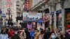 Shoppers fill the streets around Piccadilly in central London on December 12, 2020.