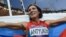 Russia's Natalya Antyukh holds her national flag as she celebrates winning the women's 400-meter hurdles final at the London 2012 Olympic Games on August 8.