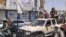 Бойцы «Талибана» в Кандагаре на автомобиле Афганской национальной армии, 13 августа 2021 года