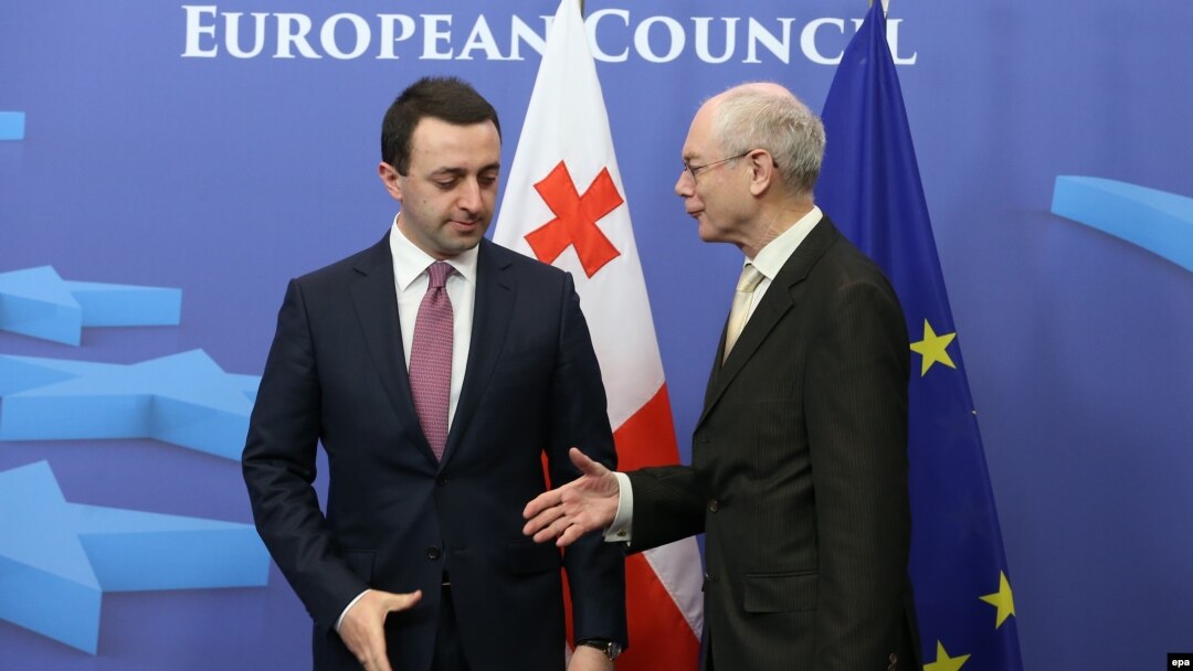 Georgian Prime Minister Irakli Garibashvili (left) with EU Council President Herman Van Rompuy in Brussels on February 4.