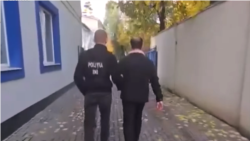 Imaginea distribuită de Poliție, după perchezițiile din 27 octombrie, în care apare socialistul Vladimir Mizdrenco.