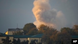 Smoke rises after shelling in Nagorno-Karabakh's main city, Stepanakert, on October 29. 