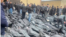 Grieving relatives searching for their loved ones among piles of bodies outside the Tehran Province Forensic Diagnostic and Laboratory Center in Kahrizak, Iran, are shown in UGC images posted on social media on January 13.
