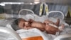 A newborn in an Iranian maternity ward. An RFE/RL investigation has uncovered online advertisements offering for adoption for hundreds of dollars. (file photo)