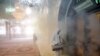 A firefighter disinfects the shrine of Saint Saleh to help prevent the spread of the new coronavirus in northern Tehran, Iran, Friday, March 6, 2020.