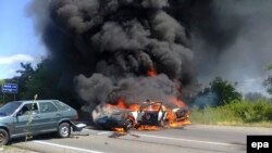 A burning police car is seen following a gunbattle in the western city of Mukacheve on July 11 between Right Sector and security forces.