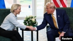 US President Donald Trump shakes hands with European Commission President Ursula von der Leyen, after an announcement of a trade deal between the US and the EU, in Scotland, July 27, 2025.