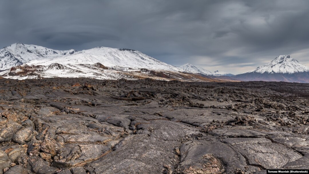 A lava flow from Kamchatka's Tobalchik Volcano, which last erupted in 1975, with the newly active Bolshaya Udina Volcano (right).